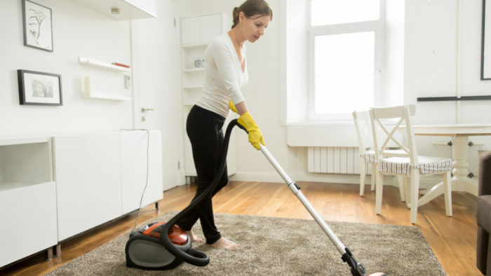 woman cleaning her carpet