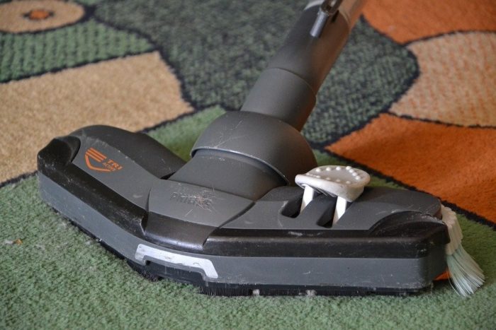 vacuuming carpet